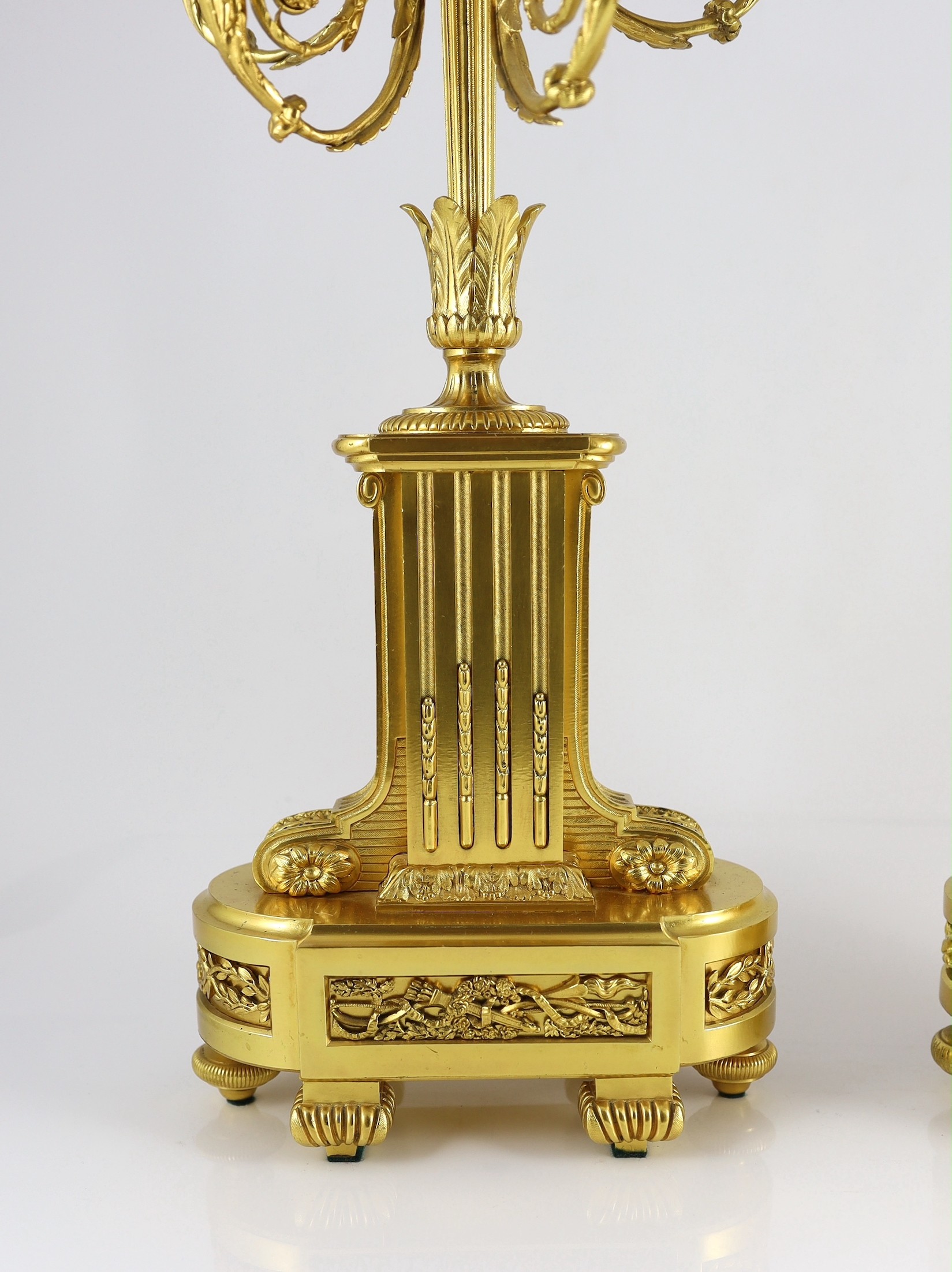 A pair of 19th century French ormolu five light candelabra, 26cm wide, 56cm high